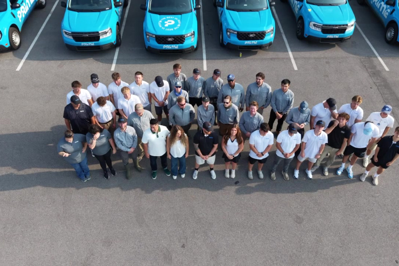 The Prime Pest Control crew in front of their service trucks