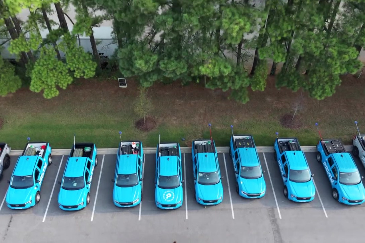 Prime Pest Control service trucks lined up at the shop